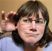 The woman is able to hear supersonic noises