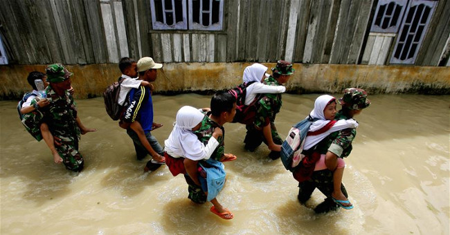 There will be millions more people facing floods warmed by the Earth