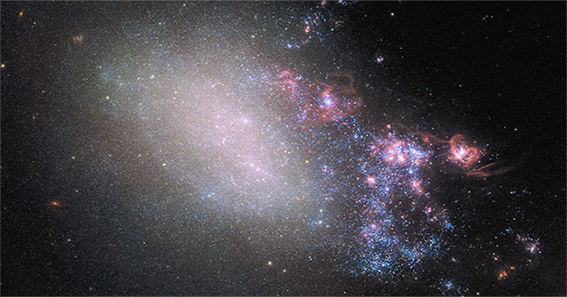 Two galaxies collide, producing a series of strange stars