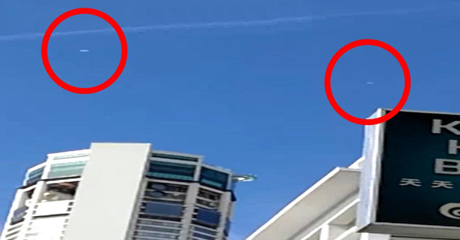 Video: Two spherical objects flying through the Malaysian sky cause a fever