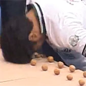 Video: Use your head to smash the most walnuts in a minute