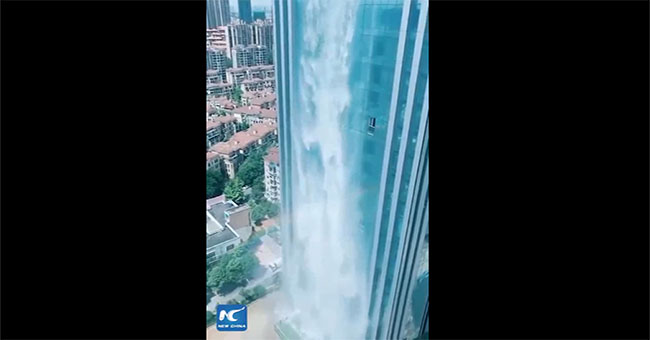 Waterfalls over hundred meters poured down from skyscrapers