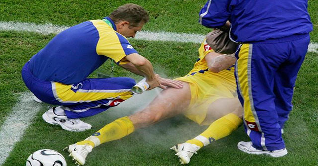 What is a football player spraying on a sore wound when he is hurt on the field?