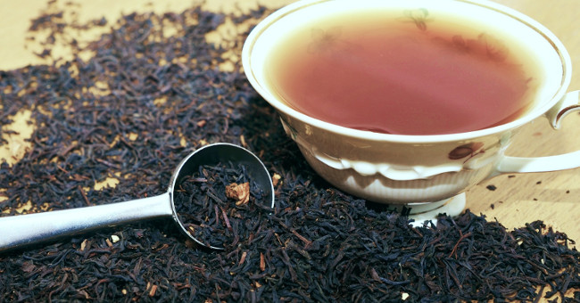 Why do British people often give milk to tea?