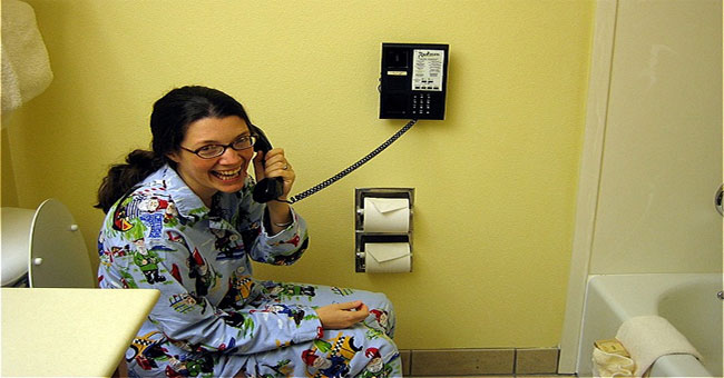 Why do hotels often have phones in the bathroom?