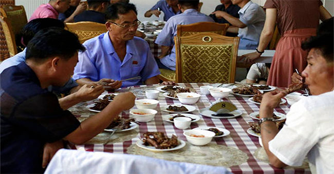 Why do Koreans eat a lot of dog meat on the hottest days?