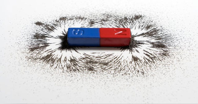Why do magnets stick together?