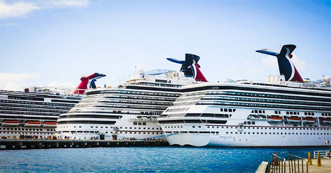 Why do most yachts are white while the cargo ships are quite colorful?