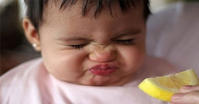 Why do people grimace when tasting sour things?
