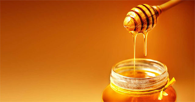 Why does honey flow in streams rather than trickle?