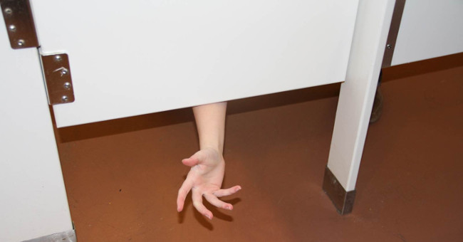 Why is the public toilet door designed with space above and below?