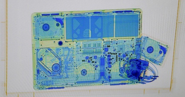 Why should I take my laptop out of my pocket when checking airport security?