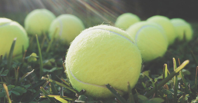 Why should you bring tennis balls with you when flying?