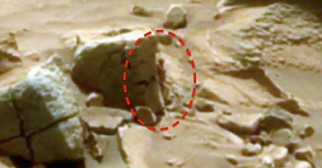 'Woman' hides behind a rock on Mars