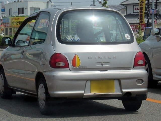 Picture 2 of Decipher the strange symbol that is stuck on cars in Japan
