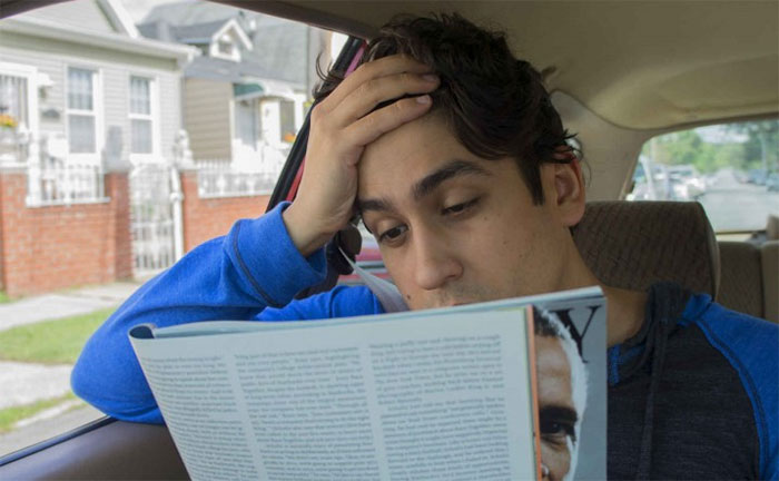 Picture 1 of Why is reading a book in the back of a car so easy to get car sick?
