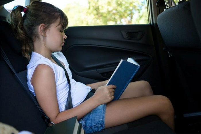 Picture 3 of Why is reading a book in the back of a car so easy to get car sick?