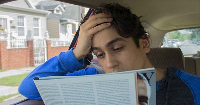 Why is reading a book in the back of a car so easy to get car sick?