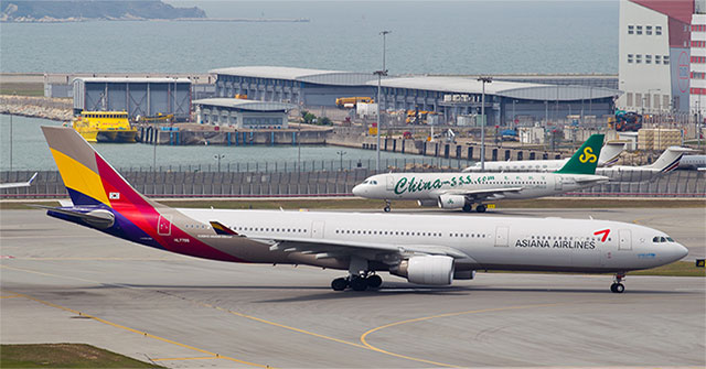 Why should you fasten your seatbelt until the aircraft comes to a complete stop?