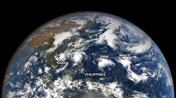 Picture 1 of 4 storms appearing at the same time in the Pacific Ocean seen from space