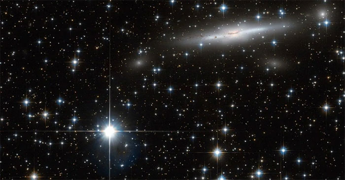 Picture 1 of 400 galaxies, including our own, are being drawn toward a mysterious