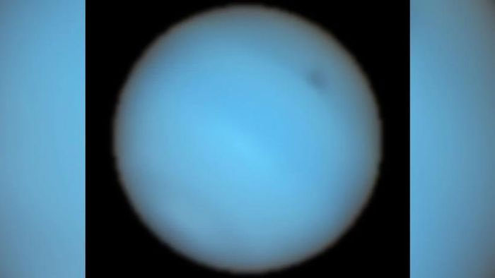 Picture 1 of Mysterious dark spot in Neptune's atmosphere
