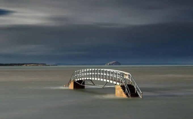 The bridge is suspended in the middle of the water with a path leading directly down to the 'aquarium' Picture 2