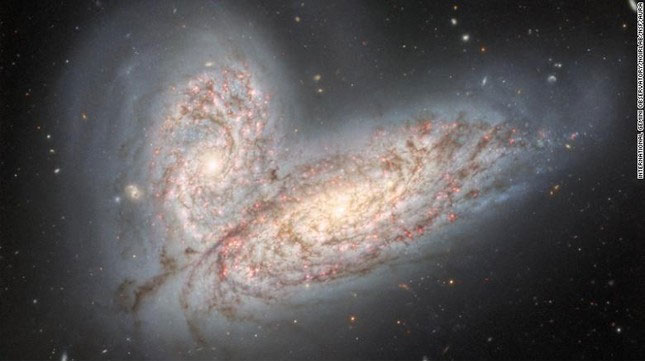 Picture 1 of The latest images of galaxies spiraling together.