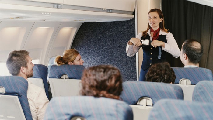 Picture 3 of Why do pilots and flight attendants always wear different seat belts than passengers?