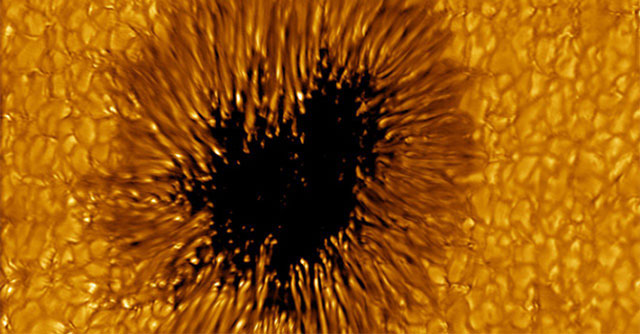 A black spot the size of Earth appears on the Sun