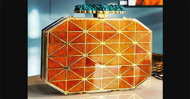 A unique and one-of-a-kind handbag made from orange peels