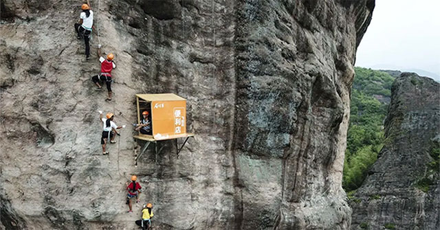 Climbing between the cliffs, this is truly the most 'inconvenient' convenience store on the planet