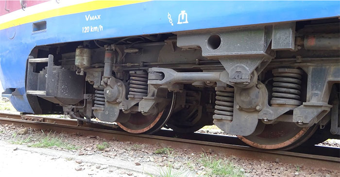 Close-up of the train wheel replacement process