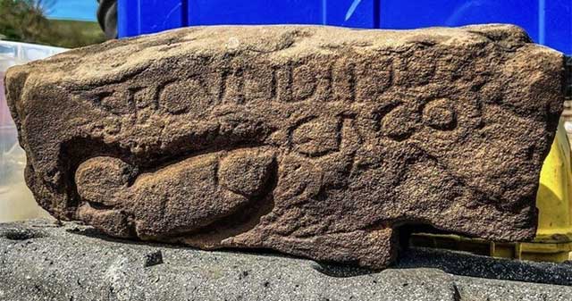 Decipher the 'vagina' carved into the rock at the Roman fortress
