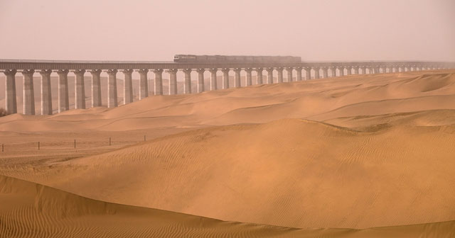 How did experts build a railway in the 'deadly' desert using 2 tons of paper to create blueprints?