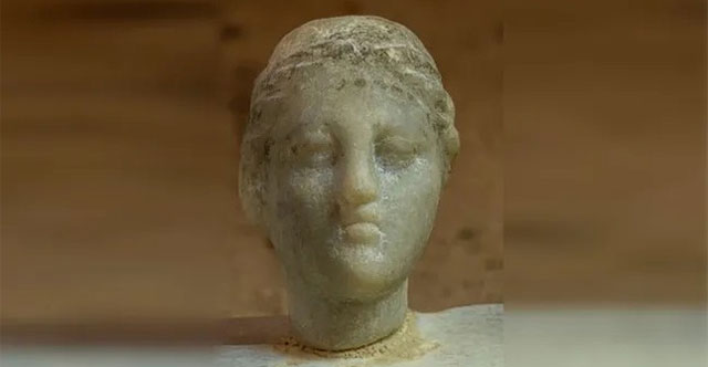 Mystery of white stone statue wearing crown believed to be Queen Cleopatra