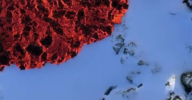 Red hot lava flowing on snow causes confusion