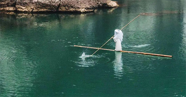 The girl possesses a nearly lost 'water-surfing' technique, performing on the river like something out of a martial arts movie.
