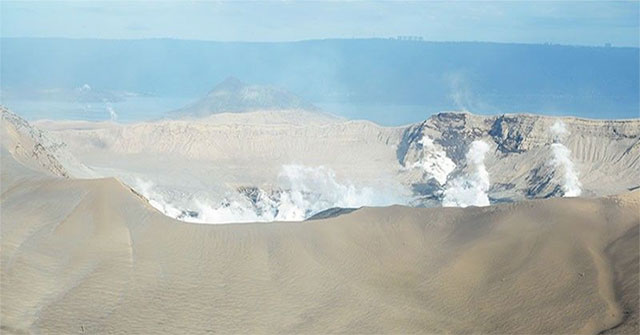 The Philippines' Taal volcano ejects a column of steam