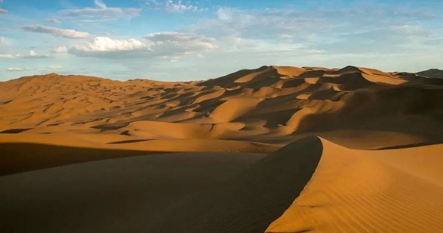 What lies beneath the thick sands of the Sahara desert in Africa?