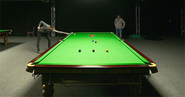 Why are pool tables usually green or blue?