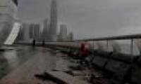 Broken pavement, sunken cars in super storm Hato in China