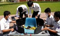Cambodian students transform school seats into convenient flying devices