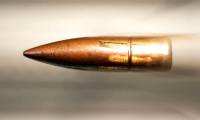 Causing large wounds like craters, how do supersonic bullets threaten people?