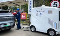 China launches 'mobile charger' for electric cars, which can move freely without a driver
