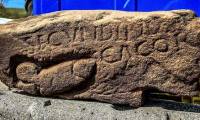 Decipher the 'vagina' carved into the rock at the Roman fortress