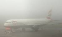 How do planes operate in thick fog?
