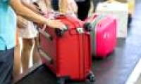 How does the suitcase always appear first on the conveyor belt?