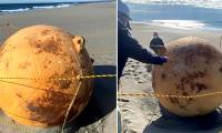 Mysterious metal sphere on Japanese beach