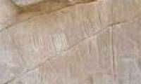 Mysterious spider figure on stone during the opening ceremony of mummy mouth